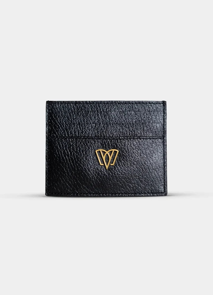 Black leather cardholder with a gold logo on a light gray background