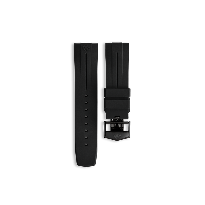 Top view of Golden Concept black rubber watch strap with textured surface, adjustment holes, and stainless steel folding butterfly clasp engraved with the Golden Concept logo