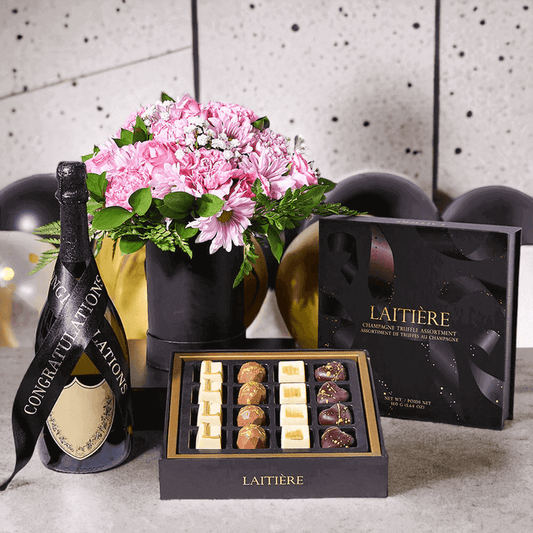 Happy Graduation Gift Set features a box of gourmet chocolate truffles and a traditional arrangement of flowers in a hat box for presentation and delivery.