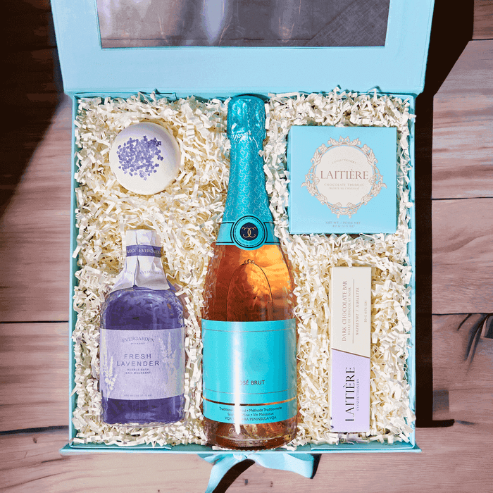"Love You, Mom!" Gift Basket. Chocolate Truffles, Hazelnut chocolate bar, Bottle of sparkling wine, Lavender-scented bubble bath, Fizzy lavender bath bomb, Stylish gift box. Champagne Gifts from Monthly Sommelier USA - Same Day USA Delivery.