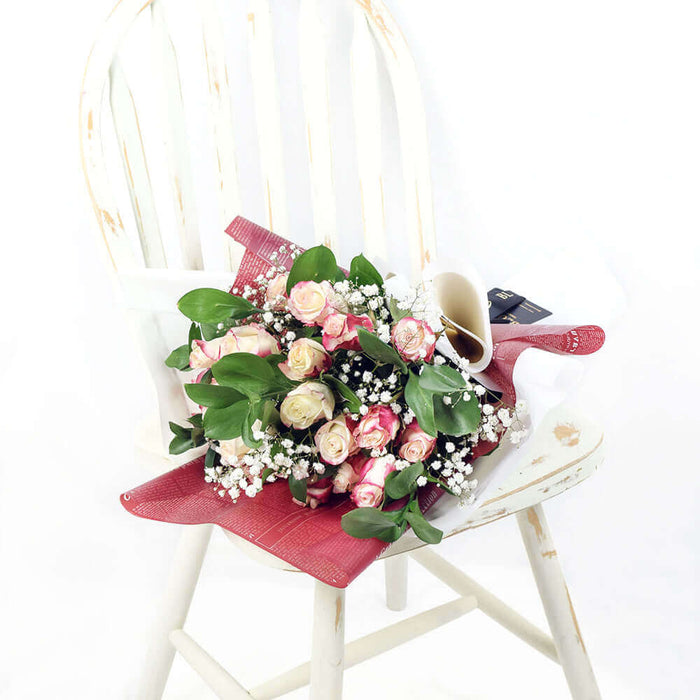 Magical Fantasy Rose Bouquet, Bunch of white and pink ombre roses, baby's breath, and salal. It is gathered in a floral wrap and tied with designer ribbon. Mixed Flower Gifts from Monthly Sommelier USA - Same Day USA Delivery.