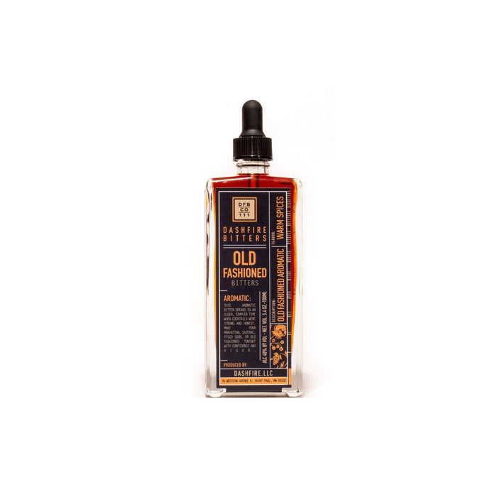 Bottle of old fashioned bitters on white background