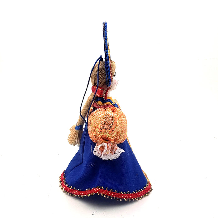 Ornament girl in a blue dress